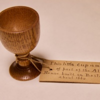 Little cup made of part of the Alden house built in Boston around 1600